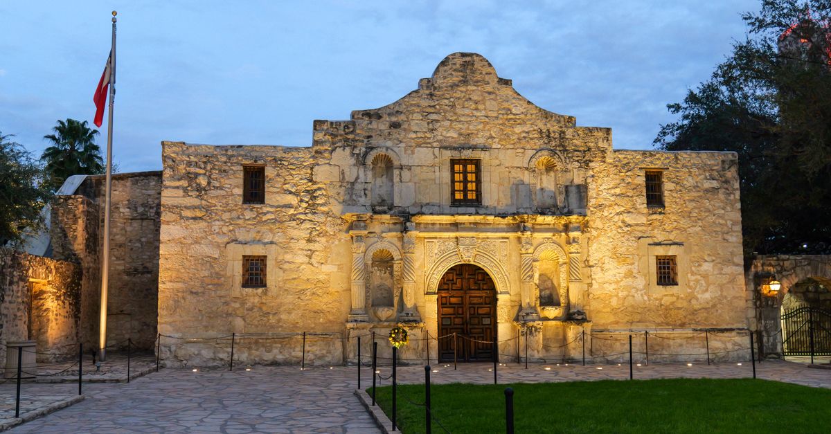 The historic Alamo in San Antonio, Texas, beautifully lit at dusk, showcasing its iconic architecture.